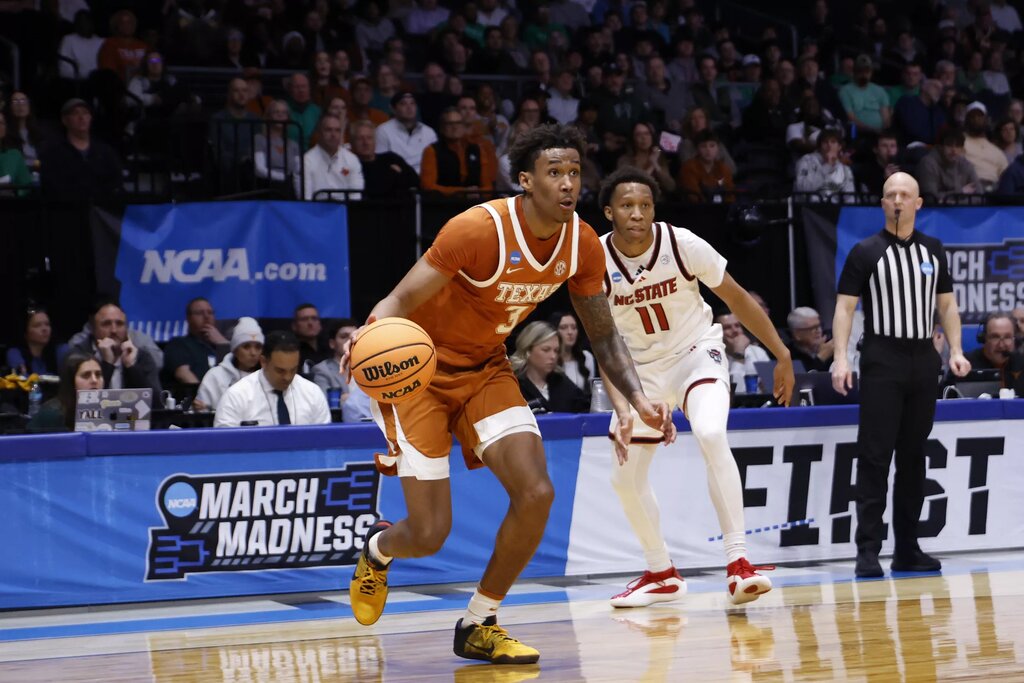 Texas Longhorns forward Dailyn Swain (3) dribbles the ball in the second half against the NC State Wolfpack during a first four game of the men's 2026 NCAA Tournament at University of Dayton Arena.