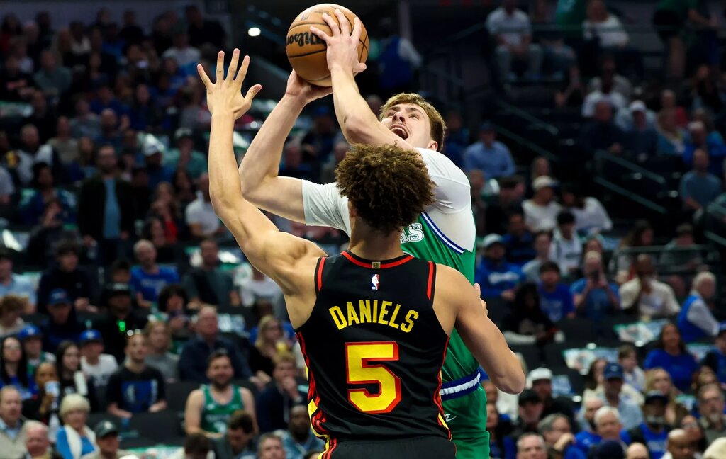 Dallas Mavericks forward Cooper Flagg (32) looks to score as Atlanta Hawks guard Dyson Daniels (5) defends during the first quarter at American Airlines Center.