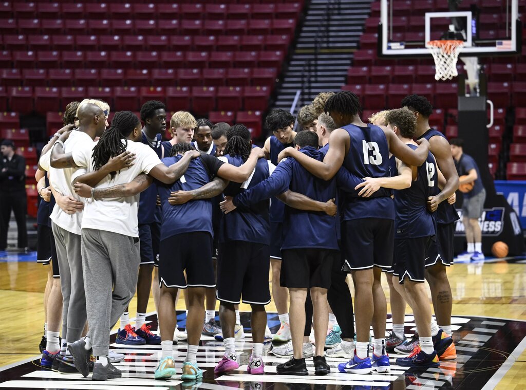 Mar 19, 2026; San Diego, CA, USA; Utah State Aggies players huddle during a practice session ahead of the first round of the men's 2026 NCAA Tournament at Viejas Arena. Mandatory Credit: Denis Poroy-Imagn Images
