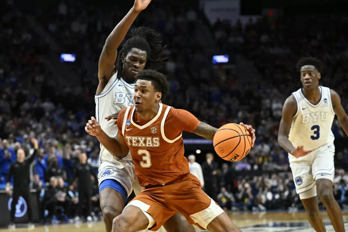 Mar 19, 2026; Portland, OR, USA; Texas Longhorns forward Dailyn Swain (3) drives against BYU Cougars forward Khadim Mboup (7) in the second half during a first round game of the men's 2026 NCAA Tournament at Moda Center. Mandatory Credit: Craig Strobeck-Imagn Images
