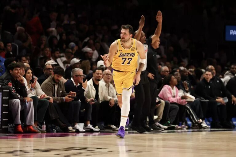 Mar 19, 2026; Miami, Florida, USA; Los Angeles Lakers guard Luka Doncic (77) reacts against the Miami Heat during the second half at Kaseya Center. Mandatory Credit: Isabella Frias-Imagn Images