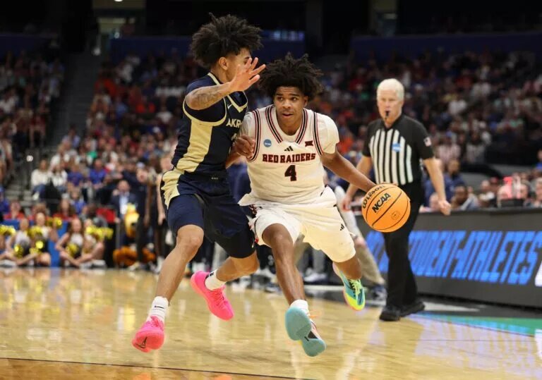 Mar 20, 2026; Tampa, FL, USA; Texas Tech Red Raiders guard Christian Anderson (4) drives against Akron Zips guard Sharron Young (3) in the second half during a first round game of the men's 2026 NCAA Tournament at Benchmark International Arena. Mandatory Credit: Nathan Ray Seebeck-Imagn Images