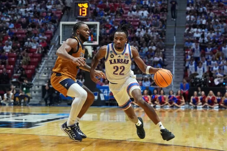 Kansas Jayhawks guard Darryn Peterson (22) controls the ball against California Baptist Lancers guard Martel Williams (33) in the first half during a first round game of the men's 2026 NCAA Tournament at Viejas Arena.
