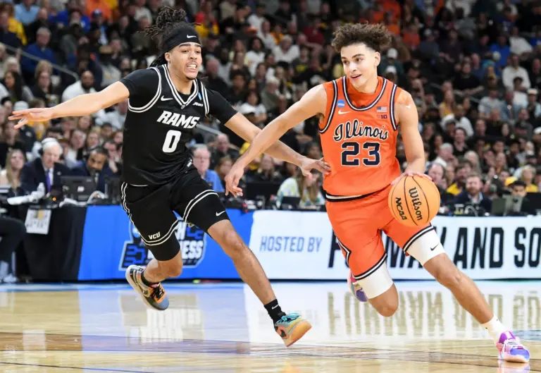 VCU Rams guard Brandon Jennings (0) defends Illinois Fighting Illini guard Keaton Wagler (23) Saturday, March 21, 2026, during the NCAA Men’s Basketball Tournament second round game at Bon Secours Wellness Arena in Greenville, South Carolina. © Alex Martin/Greenville News / USA TODAY NETWORK via Imagn Images