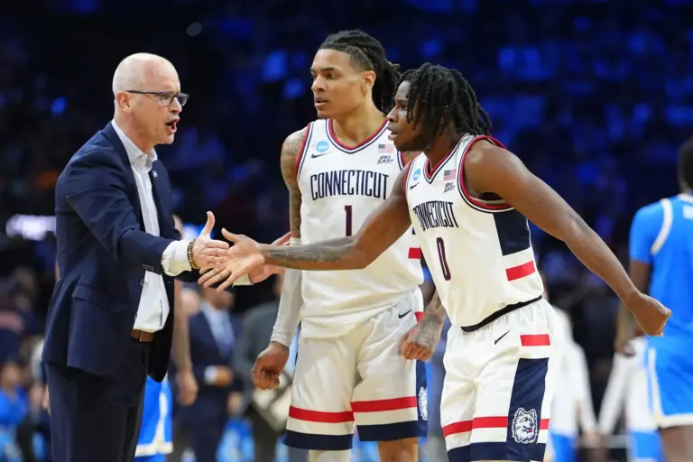 Mar 22, 2026; Philadelphia, PA, USA; UConn Huskies guard Malachi Smith (0) reacts with head coach Dan Hurley in the first half during a second round game of the men's 2026 NCAA Tournament at Xfinity Mobile Arena. Mandatory Credit: Kyle Ross-Imagn Images