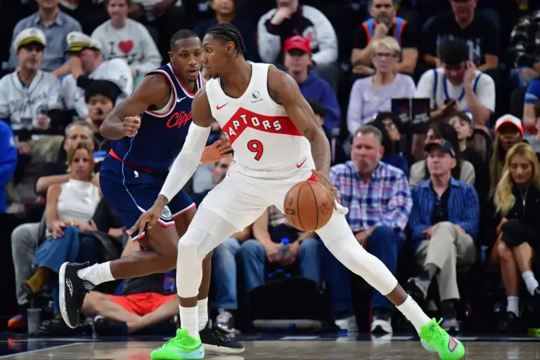 Mar 25, 2026; Inglewood, California, USA; Toronto Raptors forward RJ Barrett (9) moves the ball against Los Angeles Clippers guard Kris Dunn (8) during the second half at Intuit Dome. Mandatory Credit: Gary A. Vasquez-Imagn Images