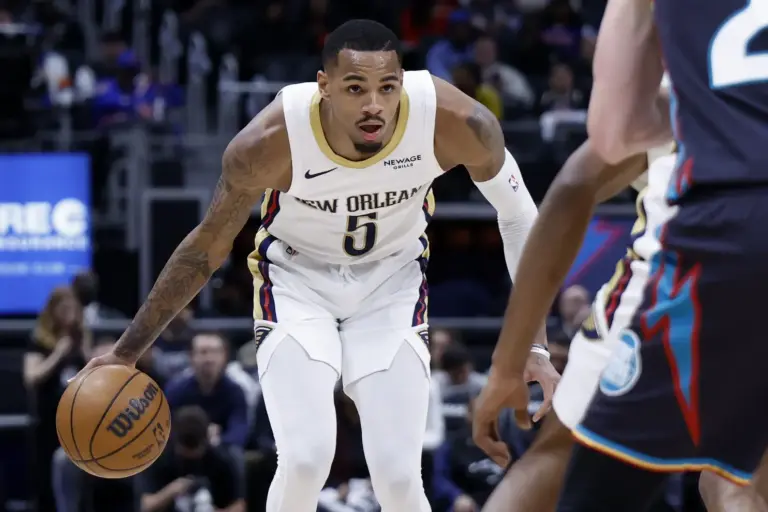 New Orleans Pelicans guard Dejounte Murray (5) dribbles in the first half against the Detroit Pistons at Little Caesars Arena.