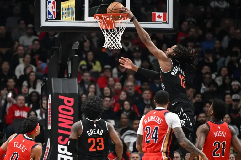 Mar 27, 2026; Toronto, Ontario, CAN; Toronto Raptors forward Collin Murray-Boyles (12) dunks against the New Orleans Pelicans in the first half at Scotiabank Arena. Mandatory Credit: Dan Hamilton-Imagn Images