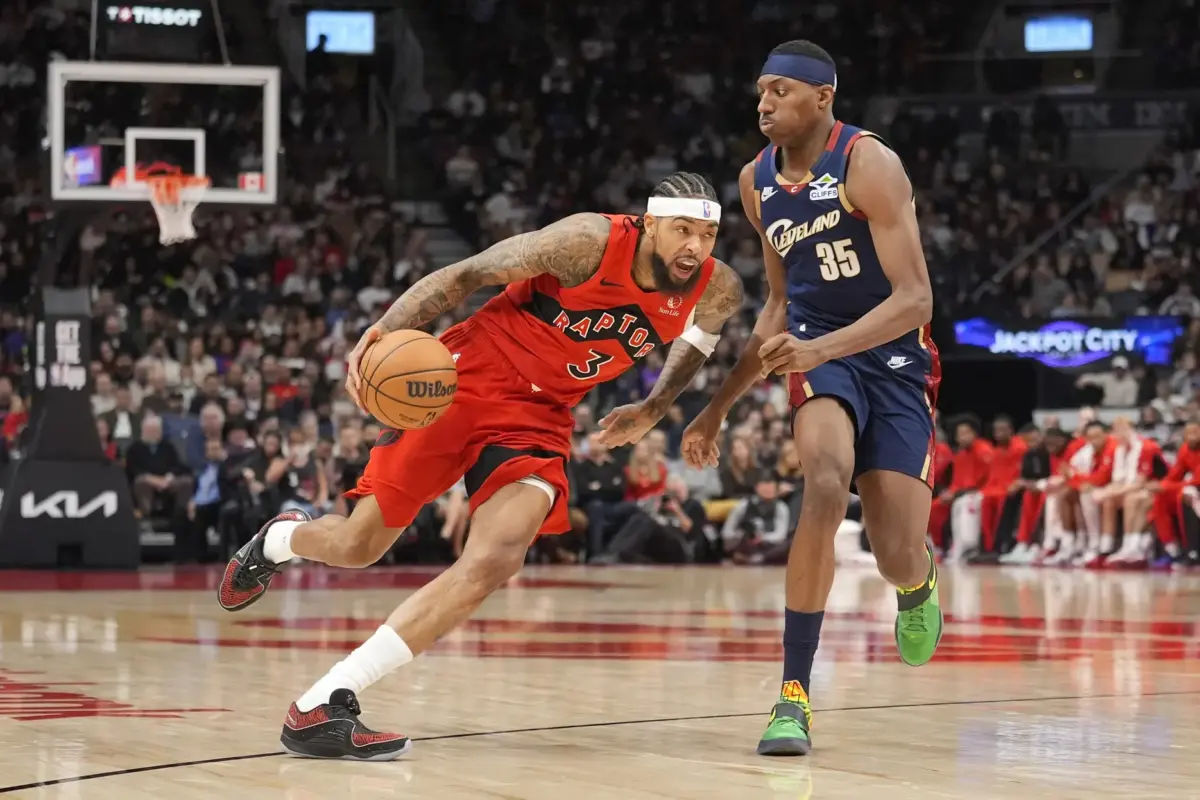 Toronto Raptors star Brandon Ingram drives against Cleveland Cavaliers wing Nae'Qwan Tomlin