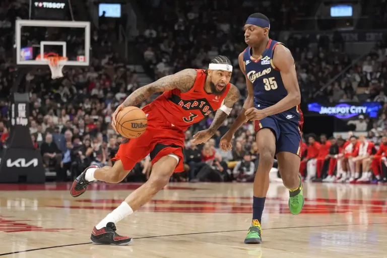 Toronto Raptors star Brandon Ingram drives against Cleveland Cavaliers wing Nae'Qwan Tomlin