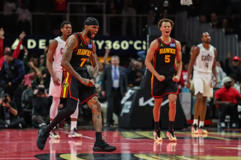 Nov 28, 2025; Atlanta, Georgia, USA; Atlanta Hawks guard Nickeil Alexander-Walker (7) and guard Dyson Daniels (5) celebrate a basket against the Cleveland Cavaliers during the fourth quarter at State Farm Arena. Mandatory Credit: Jordan Godfree-Imagn Images