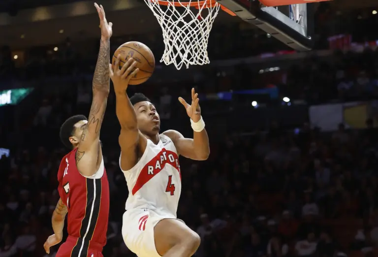 Dec 23, 2025; Miami, Florida, USA; Miami Heat center Kel'El Ware (7) defends Toronto Raptors forward Scottie Barnes (4) during the first half at Kaseya Center. Mandatory Credit: Rhona Wise-Imagn Images