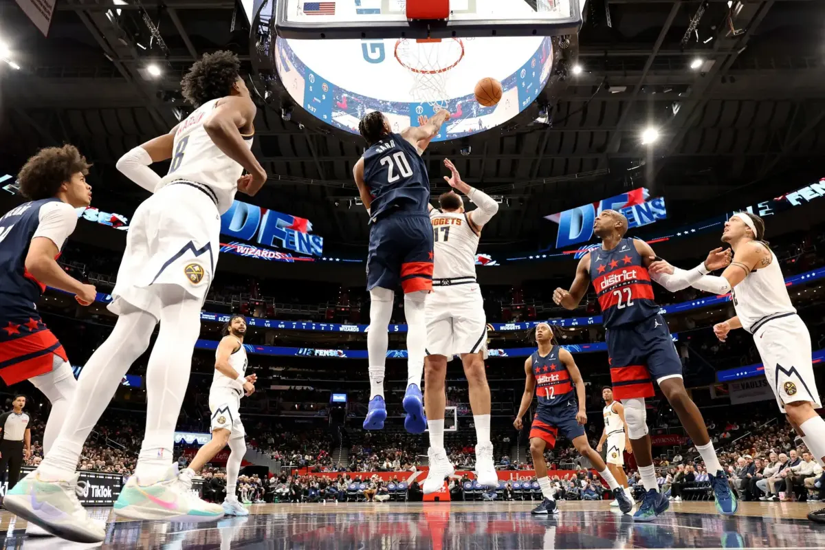 Jan 22, 2026; Washington, District of Columbia, USA; Washington Wizards center Alex Sarr (20) blocks a shot by Denver Nuggets center Jonas Valanciunas (17) during the first half against the Denver Nuggets at Capital One Arena. Mandatory Credit: Daniel Kucin Jr.-Imagn Images