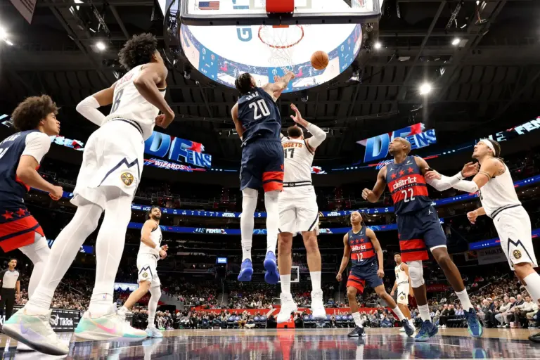 Jan 22, 2026; Washington, District of Columbia, USA; Washington Wizards center Alex Sarr (20) blocks a shot by Denver Nuggets center Jonas Valanciunas (17) during the first half against the Denver Nuggets at Capital One Arena. Mandatory Credit: Daniel Kucin Jr.-Imagn Images