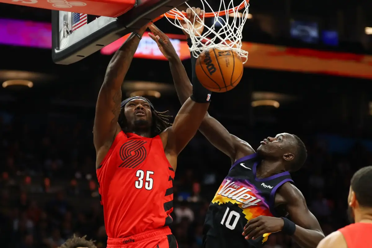 Feb 22, 2026; Phoenix, Arizona, USA; Portland Trail Blazers center Robert Williams III (35) dunks the ball against Phoenix Suns center Khaman Maluach (10) in the second half at Mortgage Matchup Center. Mandatory Credit: Mark J. Rebilas-Imagn Images