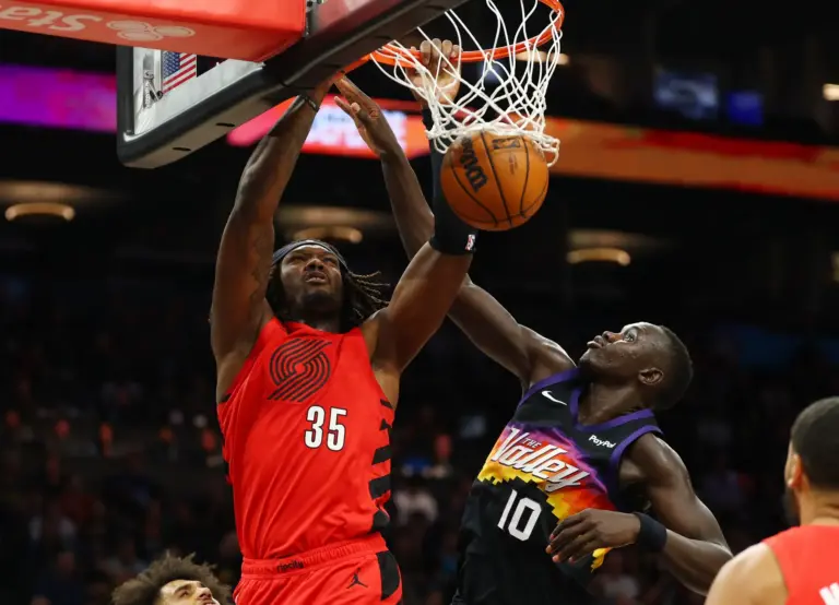 Feb 22, 2026; Phoenix, Arizona, USA; Portland Trail Blazers center Robert Williams III (35) dunks the ball against Phoenix Suns center Khaman Maluach (10) in the second half at Mortgage Matchup Center. Mandatory Credit: Mark J. Rebilas-Imagn Images