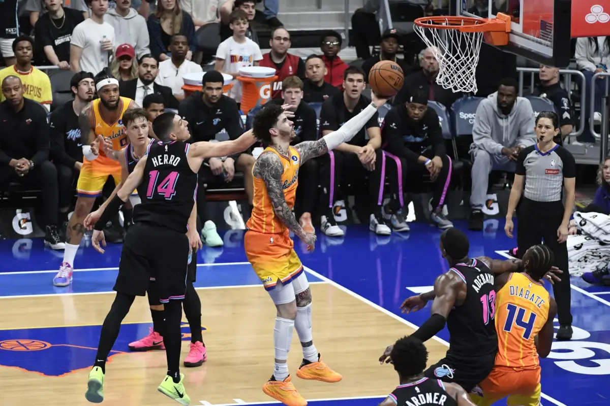 Charlotte Hornets guard LaMelo Ball (1) drives in past Miami Heat guard Tyler Herro (14) during the second half at the Spectrum Center.