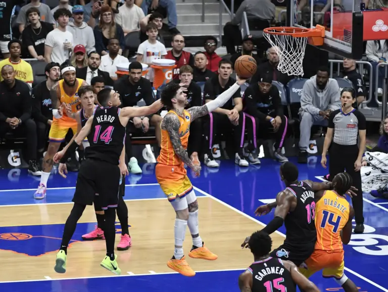 Charlotte Hornets guard LaMelo Ball (1) drives in past Miami Heat guard Tyler Herro (14) during the second half at the Spectrum Center.