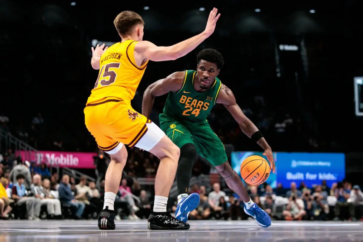 Baylor Bears guard Tounde Yessoufou (24) drives against Arizona State Sun Devils guard Noah Meeusen (15) during the second half at T-Mobile Center.