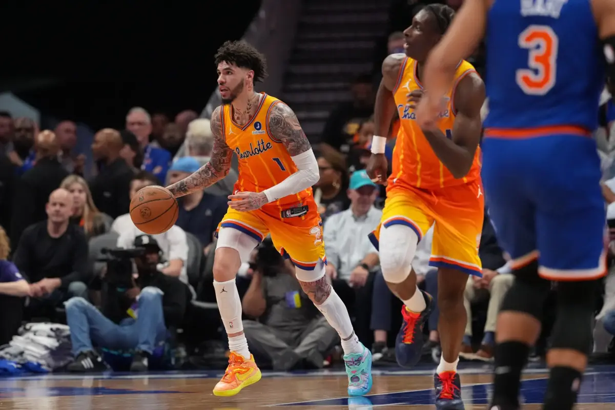 Mar 26, 2026; Charlotte, North Carolina, USA; Charlotte Hornets guard LaMelo Ball (1) grabs the rebound against the New York Knicks during the second quarter at the Spectrum Center. Mandatory Credit: Jim Dedmon-Imagn Images