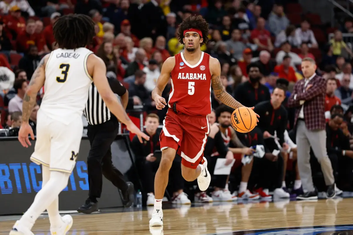 Alabama Crimson Tide forward Amari Allen (5) drives the ball in the first half against the Michigan Wolverines during a Sweet Sixteen game of the Midwest Regional of the men's 2026 NCAA Tournament at United Center.