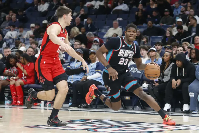 Mar 27, 2026; Memphis, Tennessee, USA; Memphis Grizzlies forward Cedric Coward (23) drives against Houston Rockets guard Reed Sheppard (15) during the second quarter at FedExForum. Mandatory Credit: Petre Thomas-Imagn Images