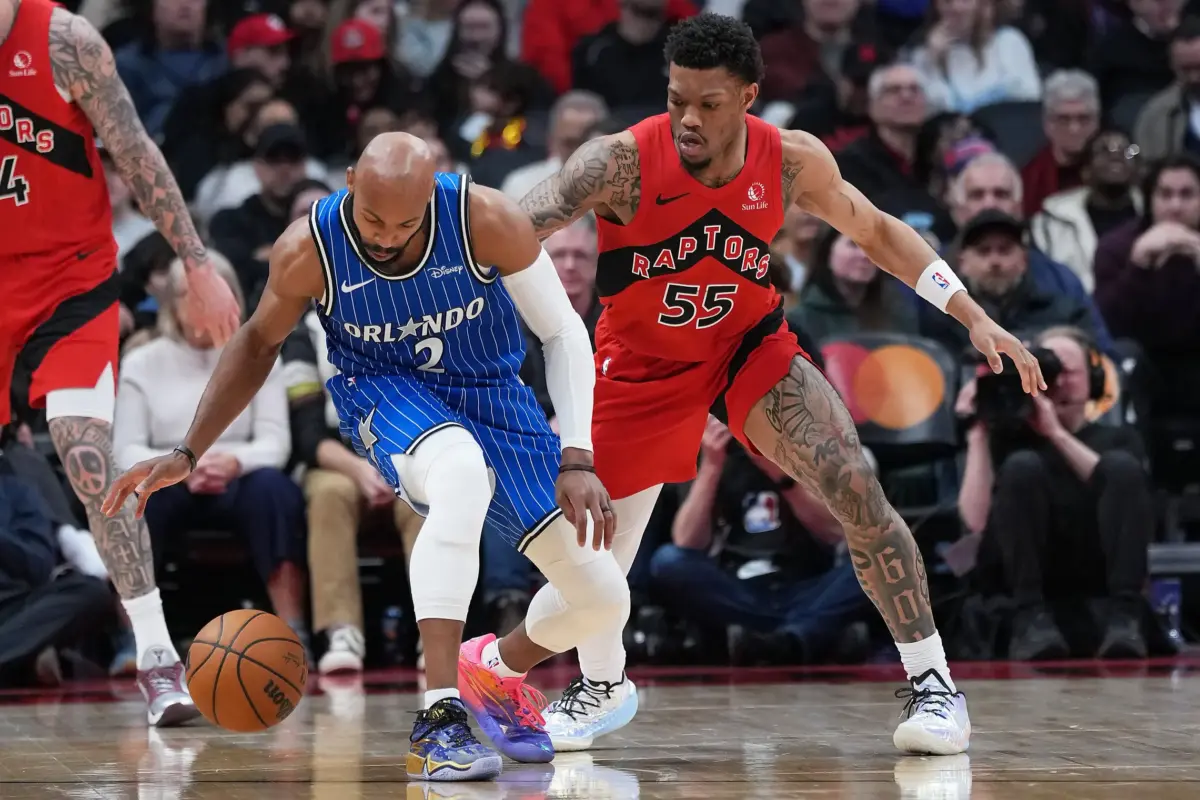 Orlando Magic guard Jevon Carter (2) controls the ball as Toronto Raptors guard Alijah Martin (55) tries to defend during the third quarter at Scotiabank Arena.