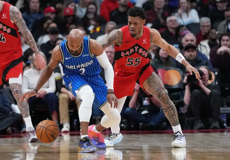 Orlando Magic guard Jevon Carter (2) controls the ball as Toronto Raptors guard Alijah Martin (55) tries to defend during the third quarter at Scotiabank Arena.