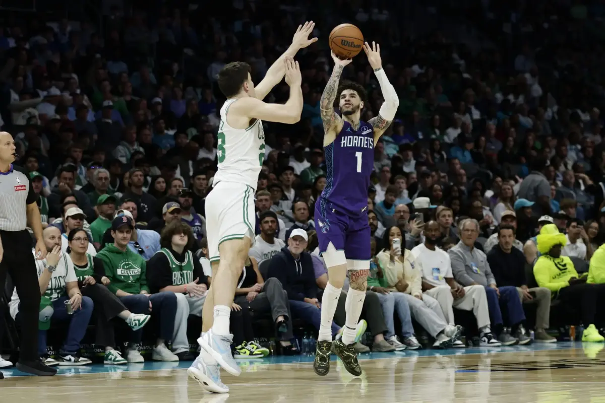 Mar 29, 2026; Charlotte, North Carolina, USA; Charlotte Hornets guard LaMelo Ball (1) shoots over Boston Celtics guard Hugo González (28) during the second half at Spectrum Center. Mandatory Credit: Brian Westerholt-Imagn Images