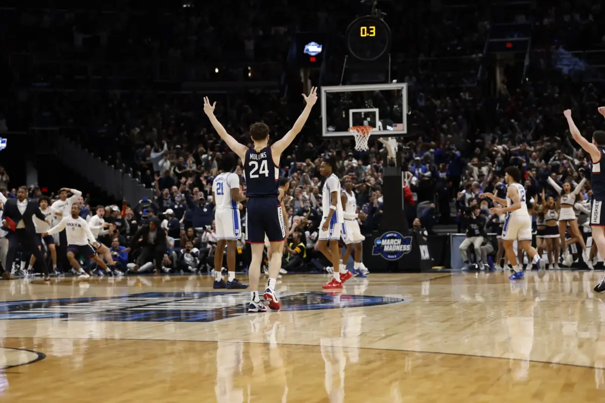 Mar 29, 2026; Washington, DC, USA; UConn Huskies guard Braylon Mullins (24) celebrates after making the game-winning three point field goal against the Duke Blue Devils in the final second of the game during an Elite Eight game of the East Regional of the men's 2026 NCAA Tournament at Capital One Arena. Mandatory Credit: Geoff Burke-Imagn Images
