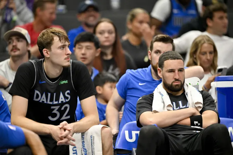 Mar 30, 2026; Dallas, Texas, USA; Dallas Mavericks forward Cooper Flagg (32) and guard Klay Thompson (31) look on from the team bench during the second half against the Minnesota Timberwolves at the American Airlines Center. Mandatory Credit: Jerome Miron-Imagn Images