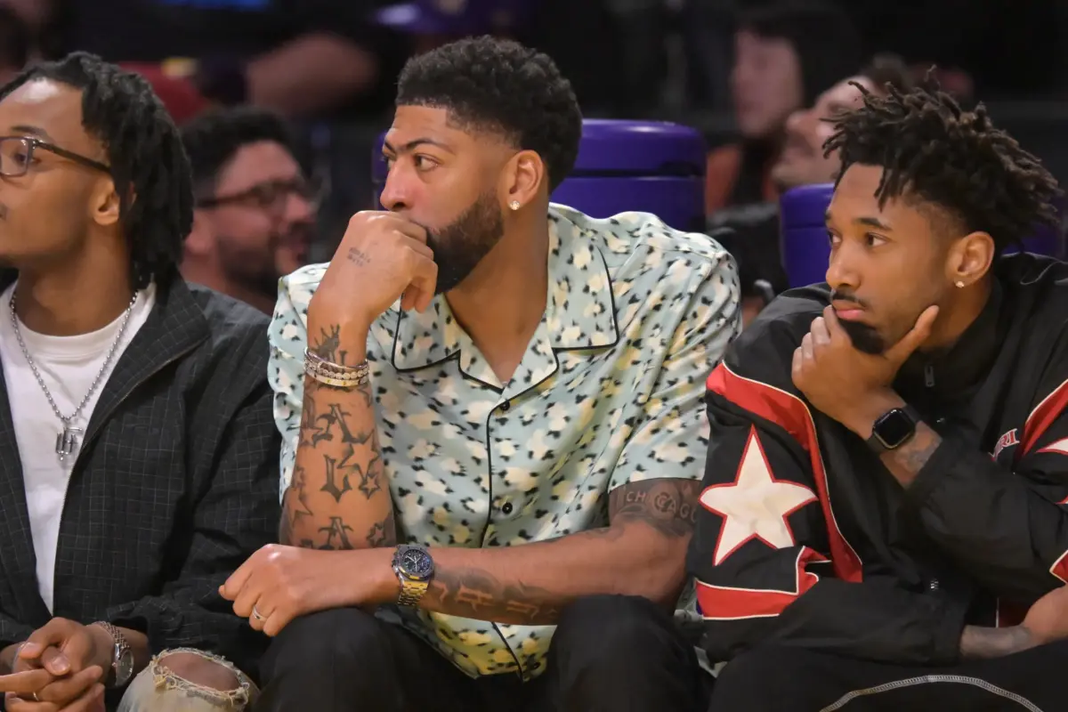 Mar 30, 2026; Los Angeles, California, USA; Washington Wizards forward Anthony Davis (23), center, looks on from the bench during the first half against the Los Angeles Lakers at Crypto.com Arena. Mandatory Credit: Jayne Kamin-Oncea-Imagn Images
