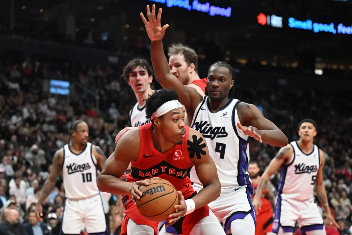 Toronto Raptors forward Scottie Barnes (4) looks for a way past Sacramento Kings forward Precious Achiuwa (9) in the second half at Scotiabank Arena.