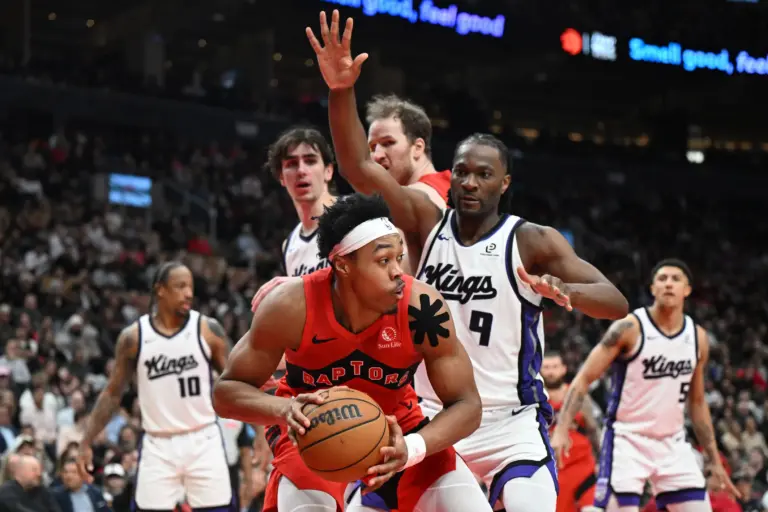 Toronto Raptors forward Scottie Barnes (4) looks for a way past Sacramento Kings forward Precious Achiuwa (9) in the second half at Scotiabank Arena.