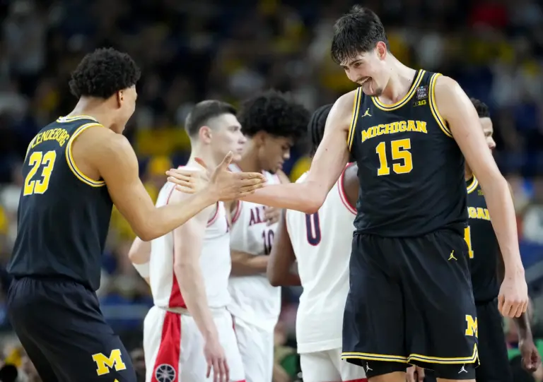 Michigan Wolverines center Aday Mara (15) and forward Yaxel Lendeborg (23) celebrate a made basket Saturday, April 4, 2026, during a Final Four game against the Arizona Wildcats at Lucas Oil Stadium in Indianapolis.
