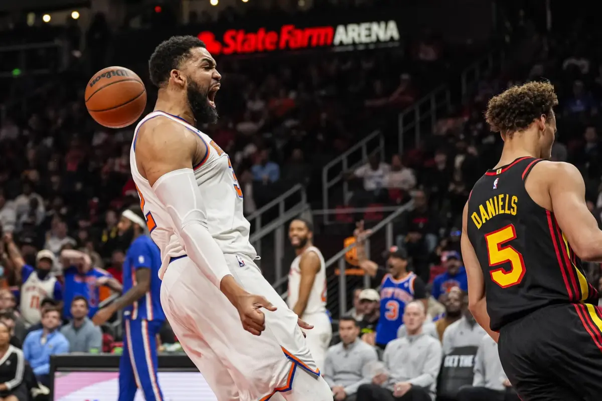 Apr 6, 2026; Atlanta, Georgia, USA; New York Knicks center Karl-Anthony Towns (32) reacts after dunking against the Atlanta Hawks during the first half at State Farm Arena. Mandatory Credit: Dale Zanine-Imagn Images