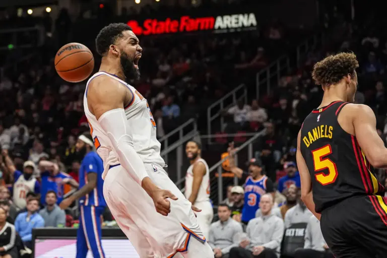 Apr 6, 2026; Atlanta, Georgia, USA; New York Knicks center Karl-Anthony Towns (32) reacts after dunking against the Atlanta Hawks during the first half at State Farm Arena. Mandatory Credit: Dale Zanine-Imagn Images