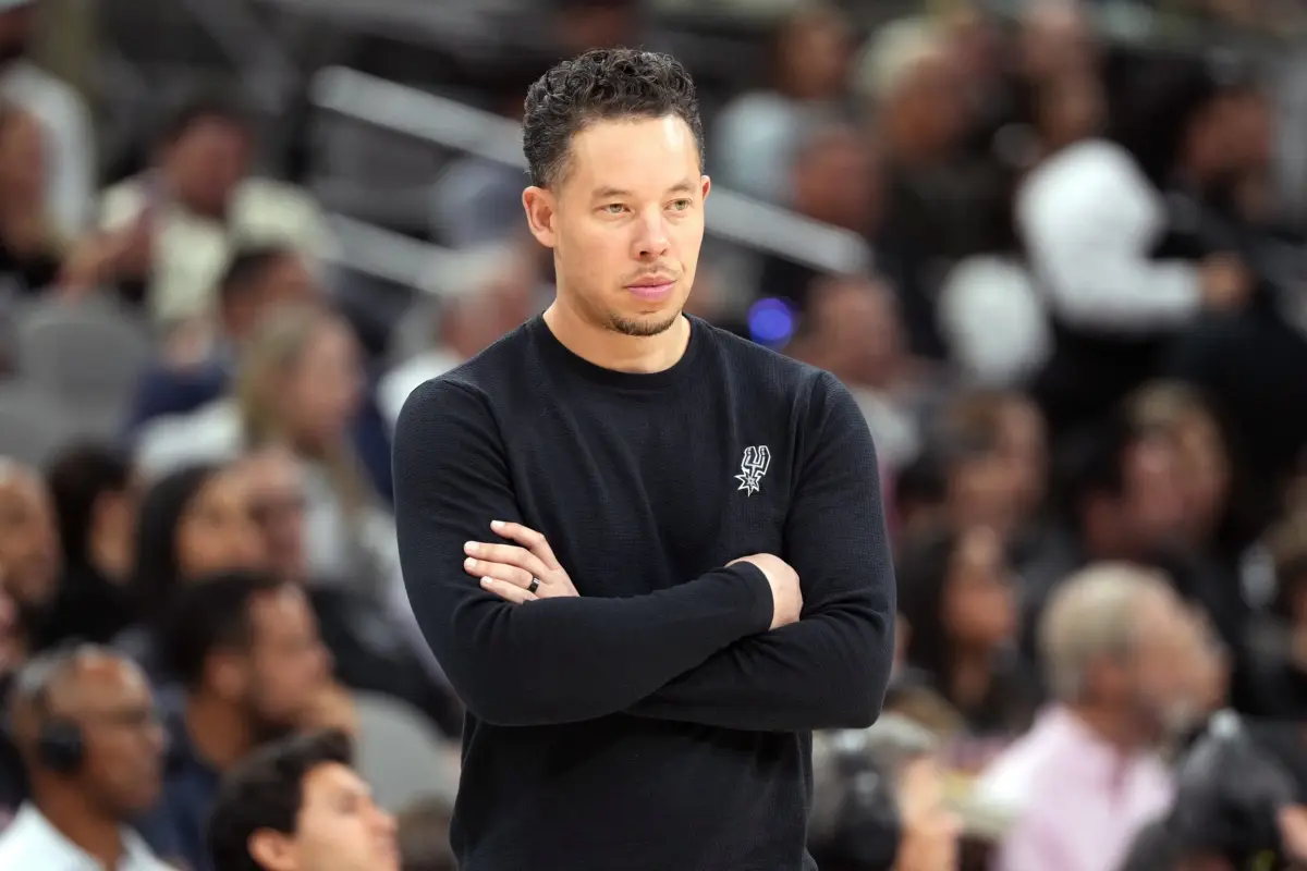 Apr 6, 2026; San Antonio, Texas, USA; San Antonio Spurs head coach Mitch Johnson observes the first half of play against the Philadelphia 76ers at Frost Bank Center. Mandatory Credit: Scott Wachter-Imagn Images