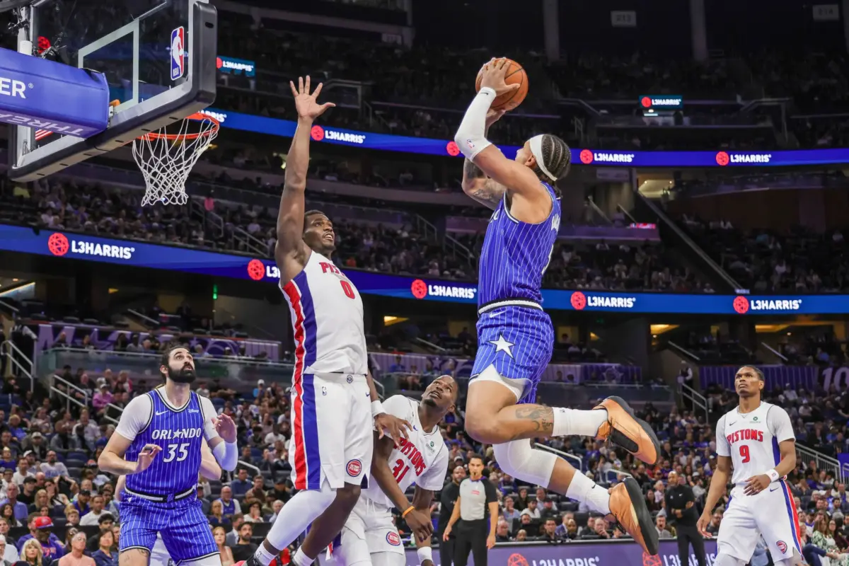 Orlando Magic forward Paolo Banchero (5) shoots against Detroit Pistons center Jalen Duren (0) during the second half at Kia Center.