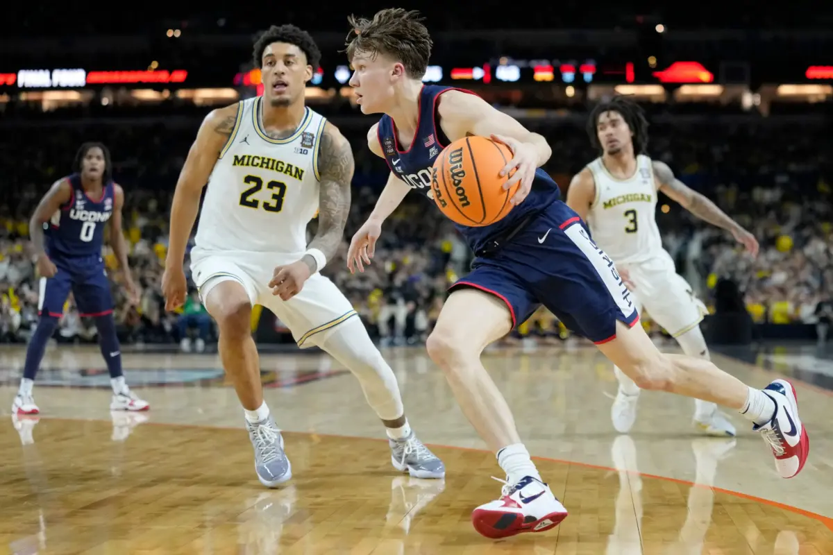 UConn Huskies guard Braylon Mullins (24) drives to the basket Monday, April 6, 2026, against the Michigan Wolverines during the NCAA men's basketball tournament national championship game at Lucas Oil Stadium in Indianapolis.