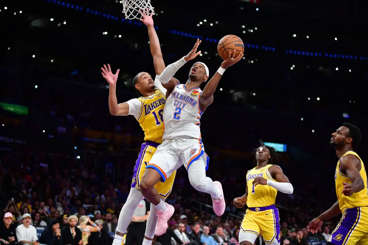 April 7, 2026; Los Angeles, California, USA; Oklahoma City Thunder guard Shai Gilgeous-Alexander (2) moves to the basket against Los Angeles Lakers guard Kobe Bufkin (18) during the second half at Crypto.com Arena. Mandatory Credit: Gary A. Vasquez-Imagn Images