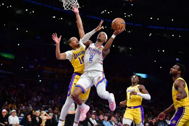 April 7, 2026; Los Angeles, California, USA; Oklahoma City Thunder guard Shai Gilgeous-Alexander (2) moves to the basket against Los Angeles Lakers guard Kobe Bufkin (18) during the second half at Crypto.com Arena. Mandatory Credit: Gary A. Vasquez-Imagn Images