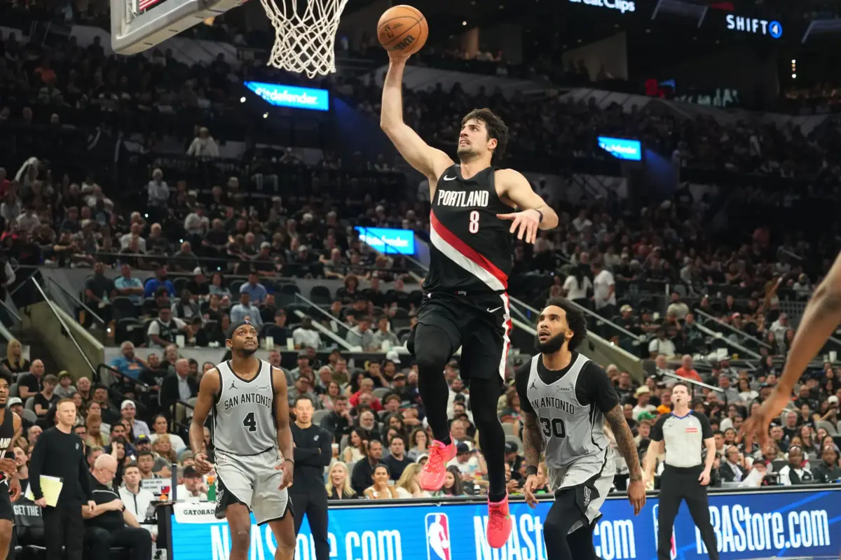 Apr 8, 2026; San Antonio, Texas, USA; Portland Trail Blazers forward Deni Avdija (8) goes up to dunk ahead of San Antonio Spurs forward Julian Champagnie (30) and guard De’Aaron Fox (4) during the second half at Frost Bank Center. Mandatory Credit: Scott Wachter-Imagn Images