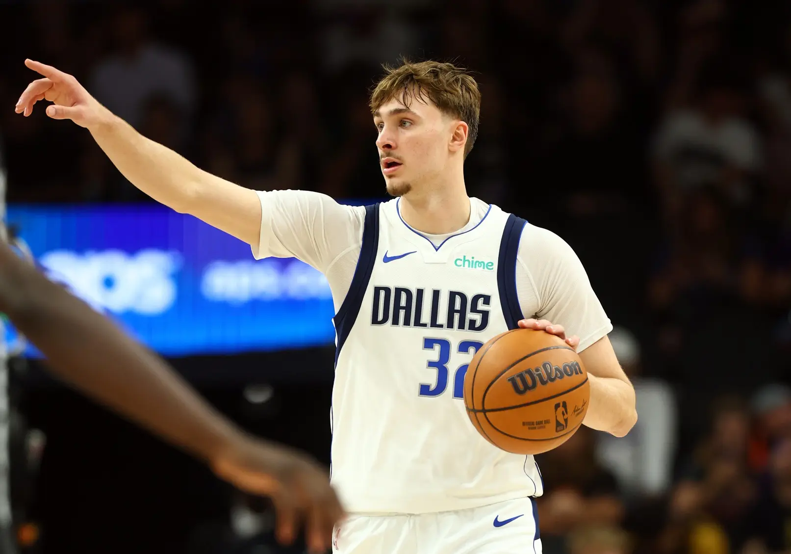 Dallas Mavericks forward Cooper Flagg (32) reacts against the Phoenix Suns in the second half at Mortgage Matchup Center.