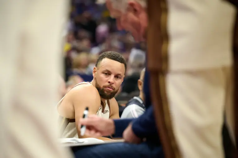 Apr 10, 2026; Sacramento, California, USA; Golden State Warriors guard Stephen Curry (30) looks on as head coach Steve Kerr draws up a play against the Sacramento Kings during the first quarter at Golden 1 Center. Mandatory Credit: Robert Edwards-Imagn Images