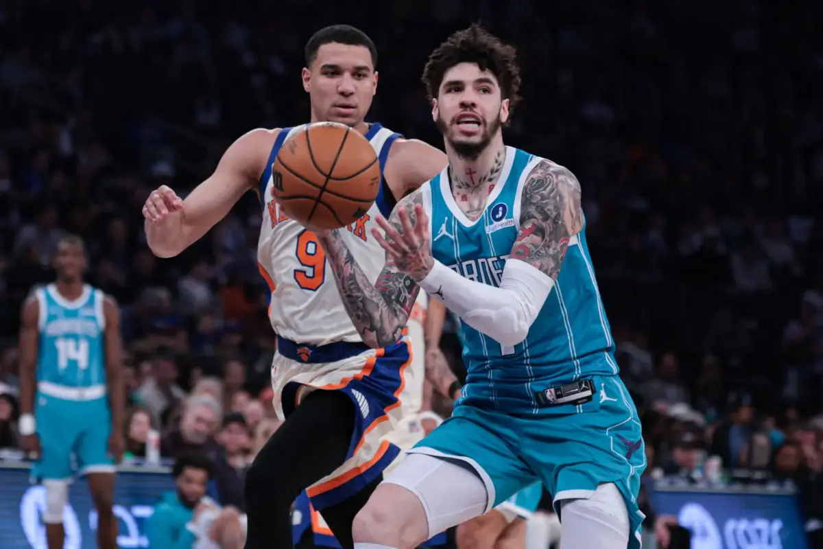 Charlotte Hornets guard LaMelo Ball (1) drives to the basket against New York Knicks guard Kevin McCullar Jr. (9) during the first half at Madison Square Garden.