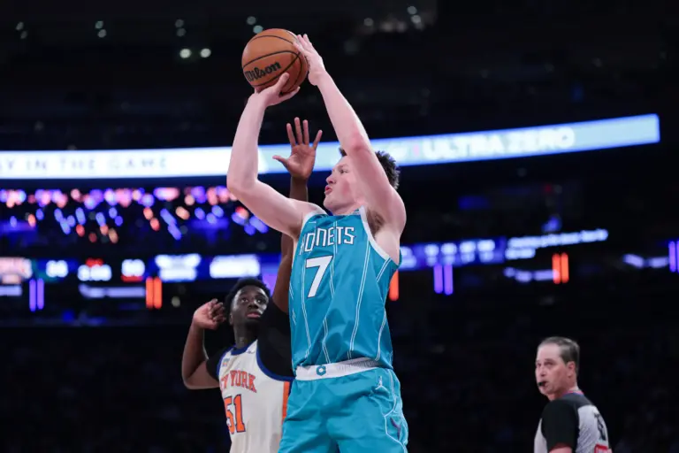 Charlotte Hornets guard Kon Knueppel (7) shoots the ball as New York Knicks forward Mohamed Diawara (51) defends during the first half at Madison Square Garden.