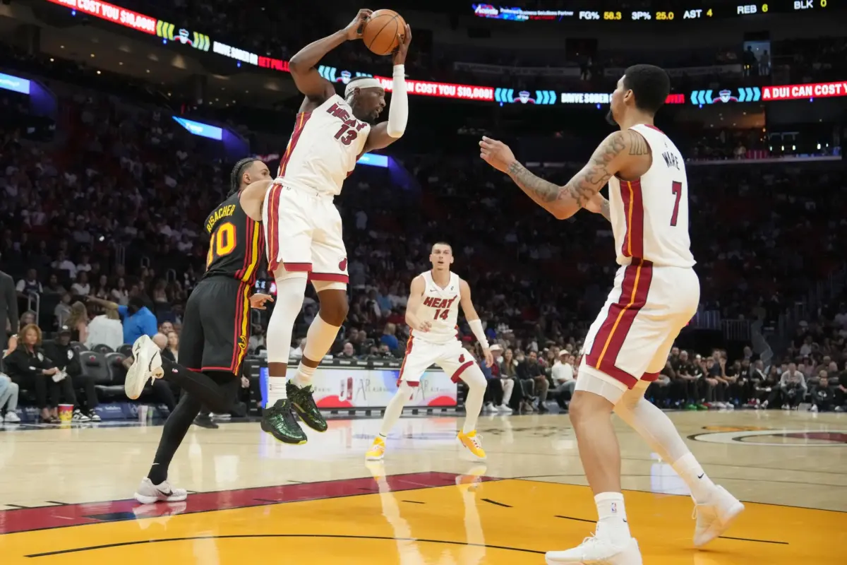 Miami Heat center Bam Adebayo (13) grabs a rebound against the Atlanta Hawks during the first half at Kaseya Center.