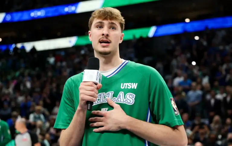 Dallas Mavericks forward Cooper Flagg (32) speaks to the crowd before the game against the Chicago Bulls at American Airlines Center.