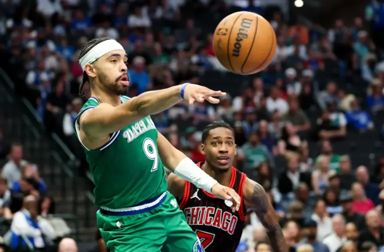 Apr 12, 2026; Dallas, Texas, USA; Dallas Mavericks guard Ryan Nembhard (9) passes the ball past Chicago Bulls guard Rob Dillingham (7) during the second half at American Airlines Center. Mandatory Credit: Kevin Jairaj-Imagn Images
